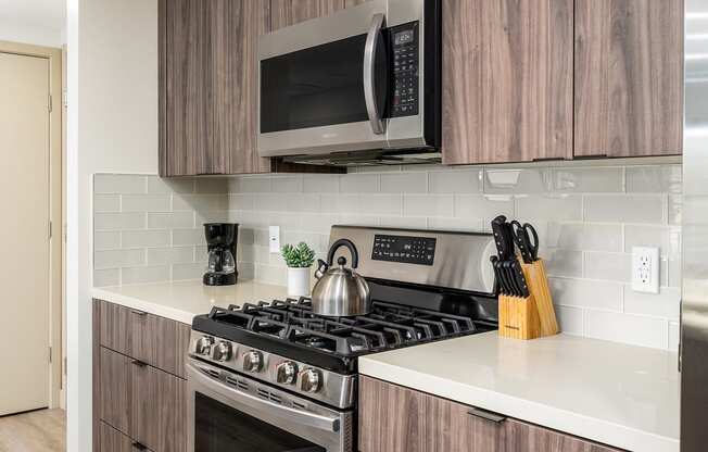 a kitchen with a stove and a microwave