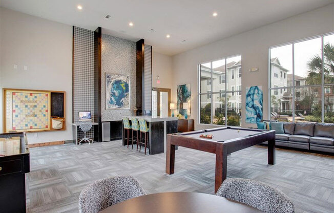 a large living room with a pool table at Volare at the Woodlands, The Woodlands, Texas