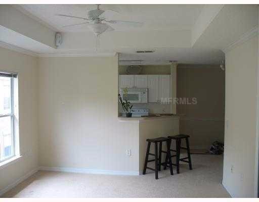 Well maintained condo, water included, in a GATED COMMUNITY with community POOL at heart of new Tampa