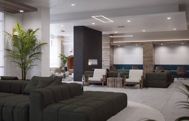 a lobby with couches and chairs and a plant