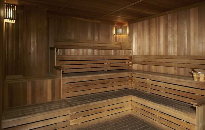 a large wooden sauna in a room with wooden walls and floors