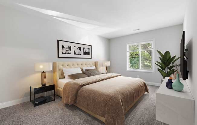 a bedroom with grey walls and a large bed  with a brown blanket at Padonia Village Apartments, Timonium MD