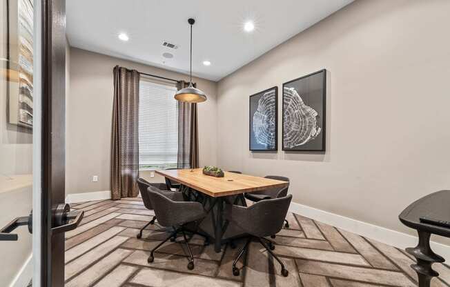 a conference room with a wooden table and chairs