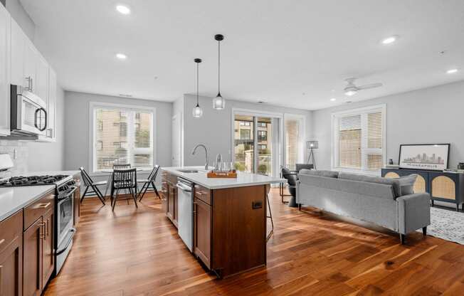 a living room with a kitchen and a dining room