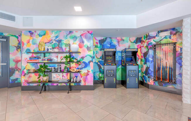 a colorful lobby with two atm machines and a bookshelf
