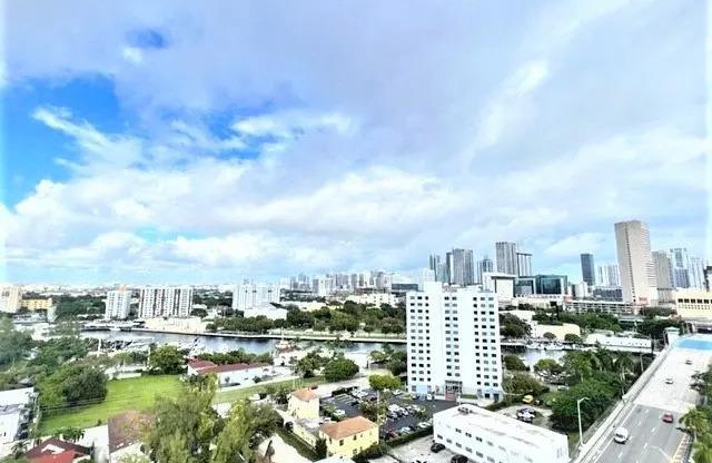 the view of the city from the balcony of a building