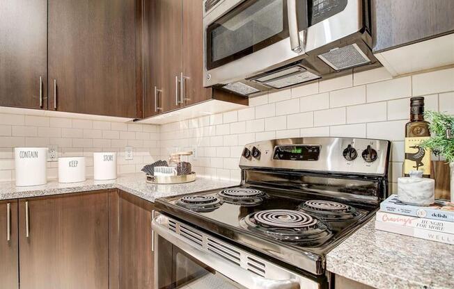 a kitchen with a stove and a microwave