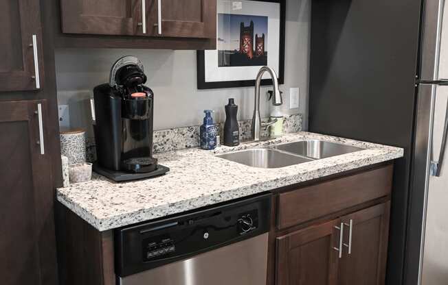 a kitchen with a sink and a dishwasher