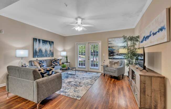 a living room with two couches and a tv