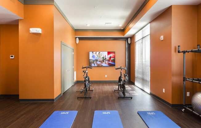 Cardio center with yoga mats and spin bikes  at LandonHouse in Lake Nona