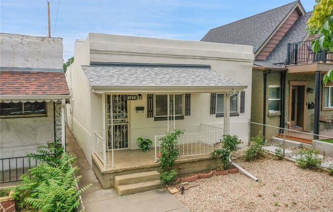 LOCATION LOCATION!!  LOHI Italian styled single family home.  Remodeled with LVT flooring, Granite counter tops & fenced-in-yard!