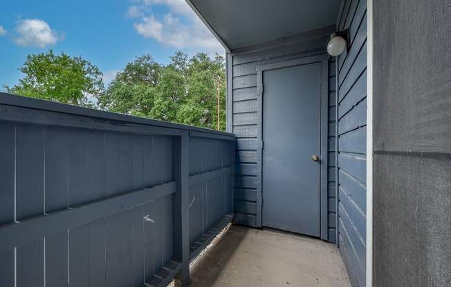 A blue door is on the right side of the image.