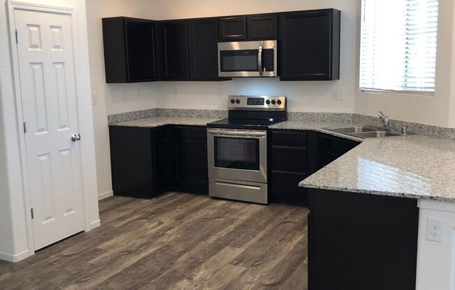 $2395.00 - NEW FLOORING UPSTAIRS - STAINLESS - GRANITE - NO YARD TO MAINTAIN