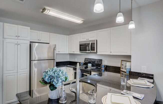 a kitchen with stainless steel appliances and a counter top