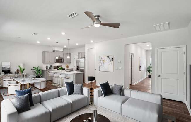 an open living room and kitchen with couches and a table