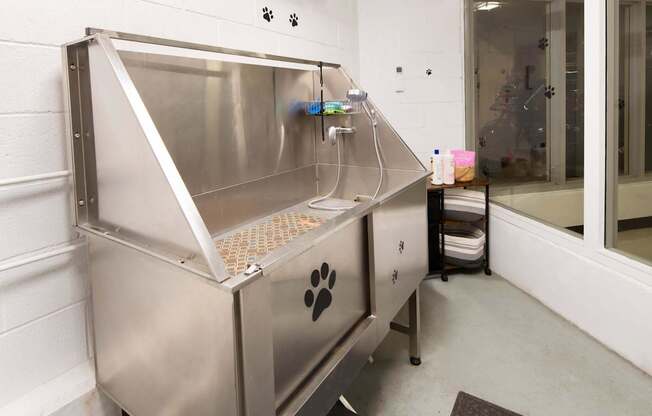 A large stainless steel machine with a paw print on it.