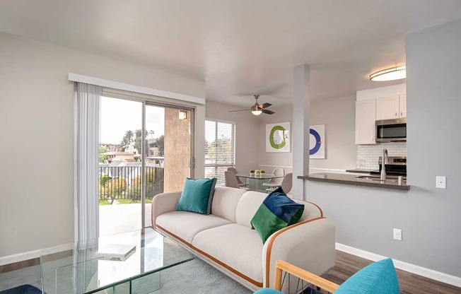 Glass Door, Sofa In Living Room at Los Robles Apartments, Pasadena, CA