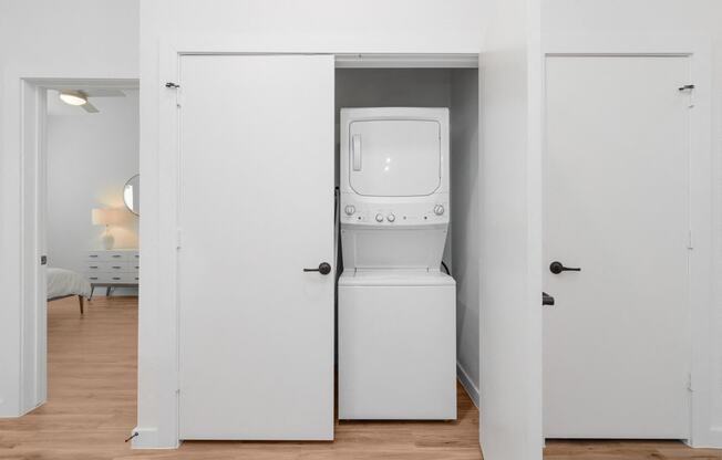 a room with a washer and dryer in a closet