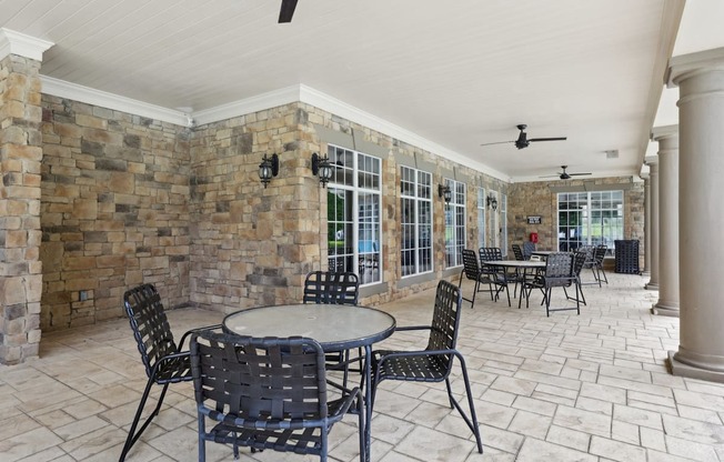 A patio with a table and chairs.