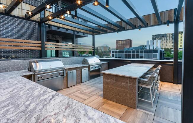 Gather friends and elevate your evenings at Modera Golden Triangle's rooftop outdoor kitchen.