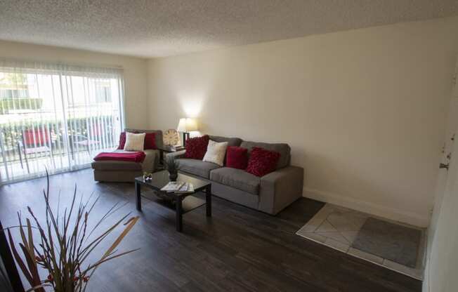 This is a photo of the living room in the 653 square foot 1 bedroom apartment at Princeton Court Apartments in Dallas, TX.