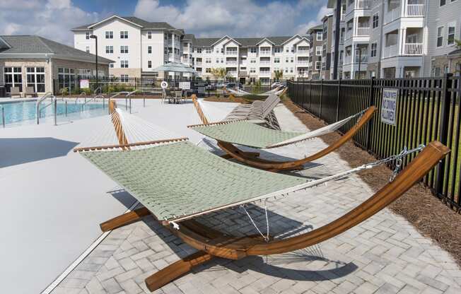 Poolside sundeck with hammocks and lounge chairs at at the Station at Savannah Quarters in Pooler, GA
