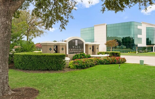 a large building with a grassy area in front of it