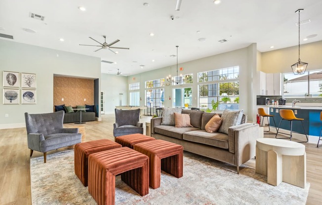 lounge with a couch and tables at Reserve at Temple Terrace, Temple Terrace, FL