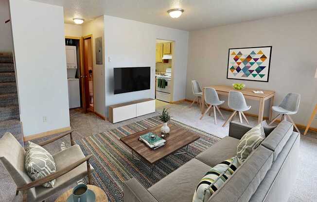 A living room with a grey couch and a coffee table.