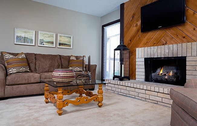 a living room with a fireplace and a couch