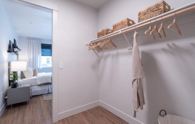 a bathroom with a closet and a mirror in a living room at Sonder Fields in Happy Valley, OR