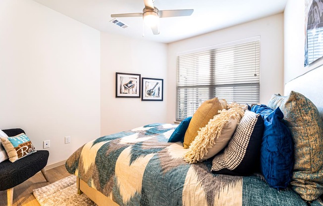 Bedroom with a bed and a ceiling fan at The Parker Austin, Pflugerville, 78660