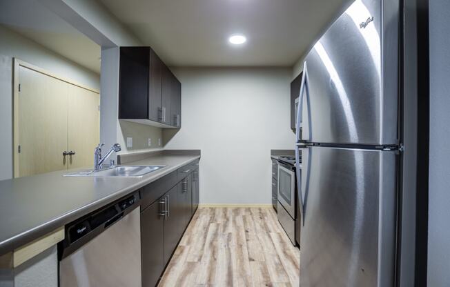 Fully Equipped Kitchen with Refrigerator, Microwave, and dishwasher
