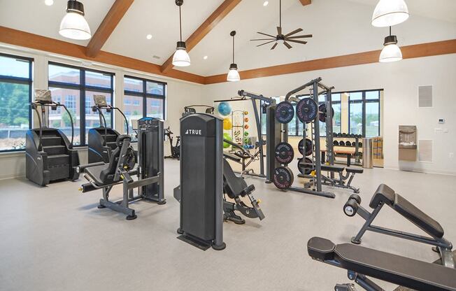 the residence apartments fitness room with exercise equipment