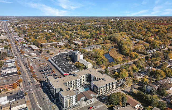 A large building with a parking lot in front of it.