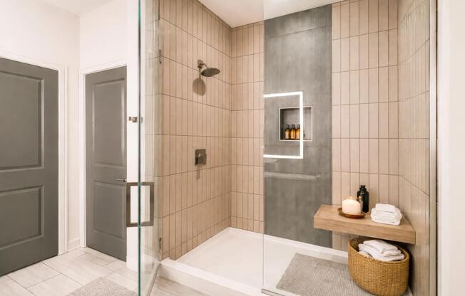 Penthouse bathrooms feature spa-inspired showers, clean-lined tilework, and refined finishes designed for everyday comfort and ease.