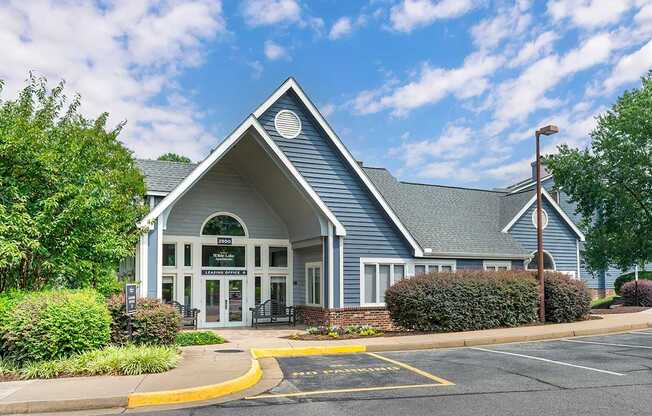 the building where the hotel is located is shown with a parking lot