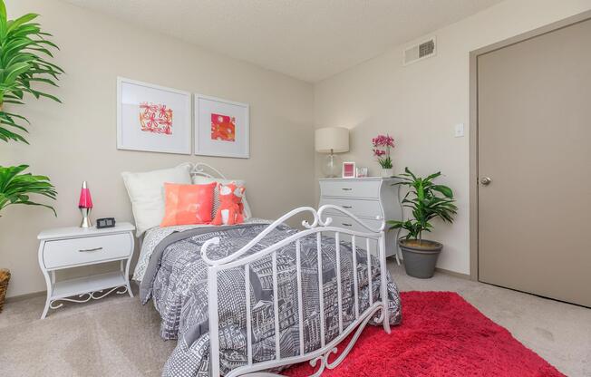 furnished bedroom with a grey comforter