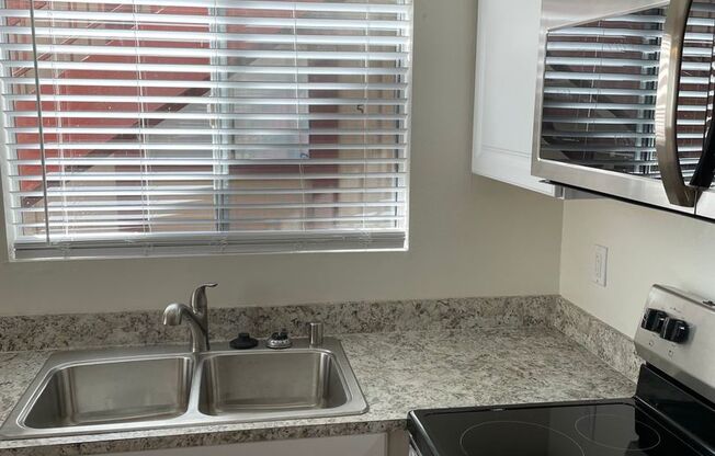 Bright and Charming 3 Bedroom 2 Bath Condo with Patio and A/C!