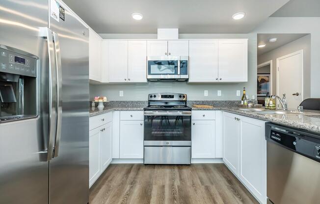 a large kitchen with stainless steel appliances