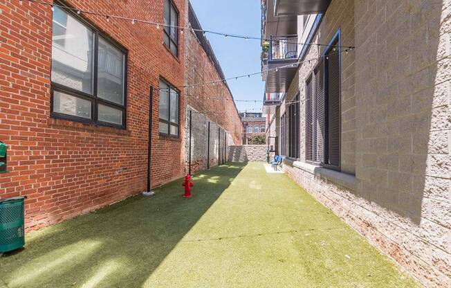 Courtyard With Green Space at Link Apartments® West End, South Carolina, 29601