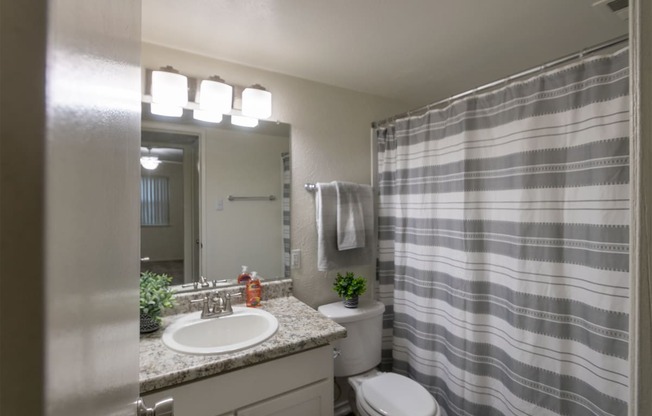 This is a photo of the primary bathroom in the 970 square foot 2 bedroom, 2 bath apartment at Preston Park Apartments in Dallas, TX