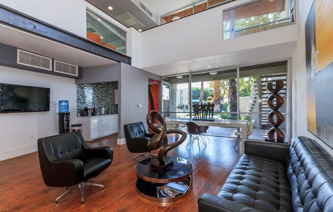 a living room filled with furniture and a large window