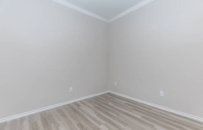 a room with gray walls and a wooden floor
