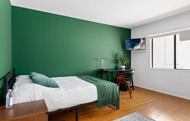 A fully furnished 4 bedroom, 2 bathroom apartment with common areas at 1823 Pelham Ave. Unit 5