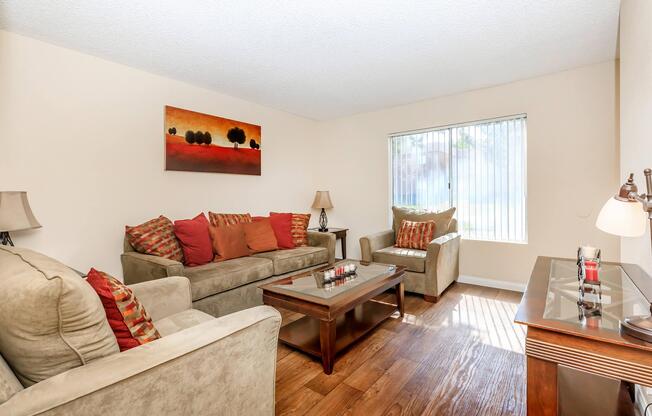 a living room filled with furniture and a flat screen tv