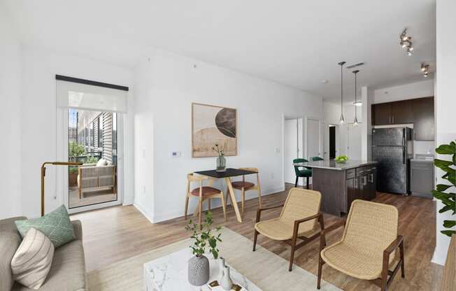 a living room with a couch and a table with chairs