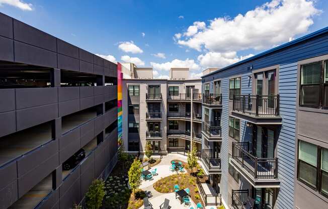 a view of a courtyard in a mix of apartment buildings