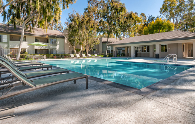 a house with a pool outside of a building