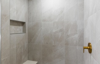 Premium homes feature extra indulgences as well, including hand shower systems in five-piece bathrooms